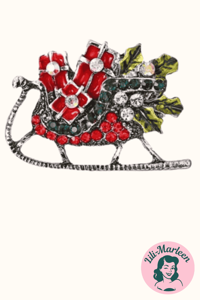 Broche - slæde med gaver