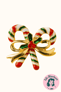 Broche - slikstokke med guld bånd