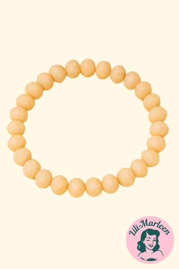 Emely – Elastisk Armbånd med Cremefarvede Facetperler