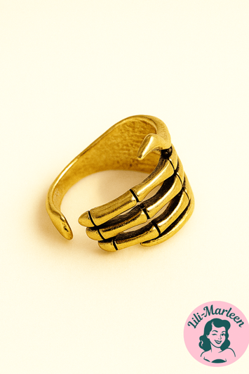 Golden Grip Øreklemme i guldlook formet som skelet-hånd