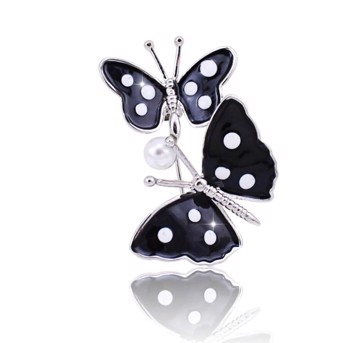 Broche - 2 sommerfugle i sort med hvide prikker og lille perle